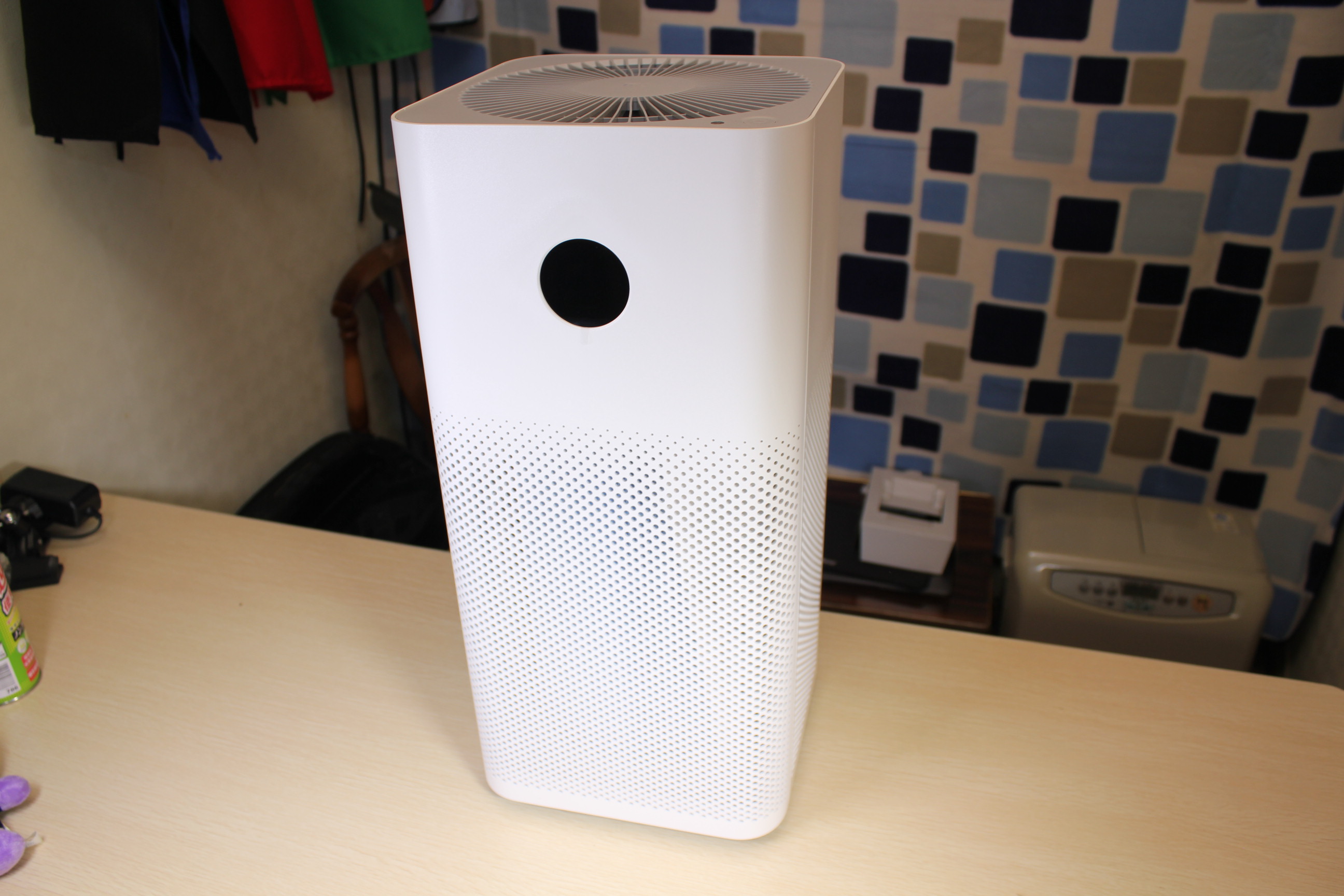 Xiaomi smart HEPA air purifier with display panel on kitchen counter

