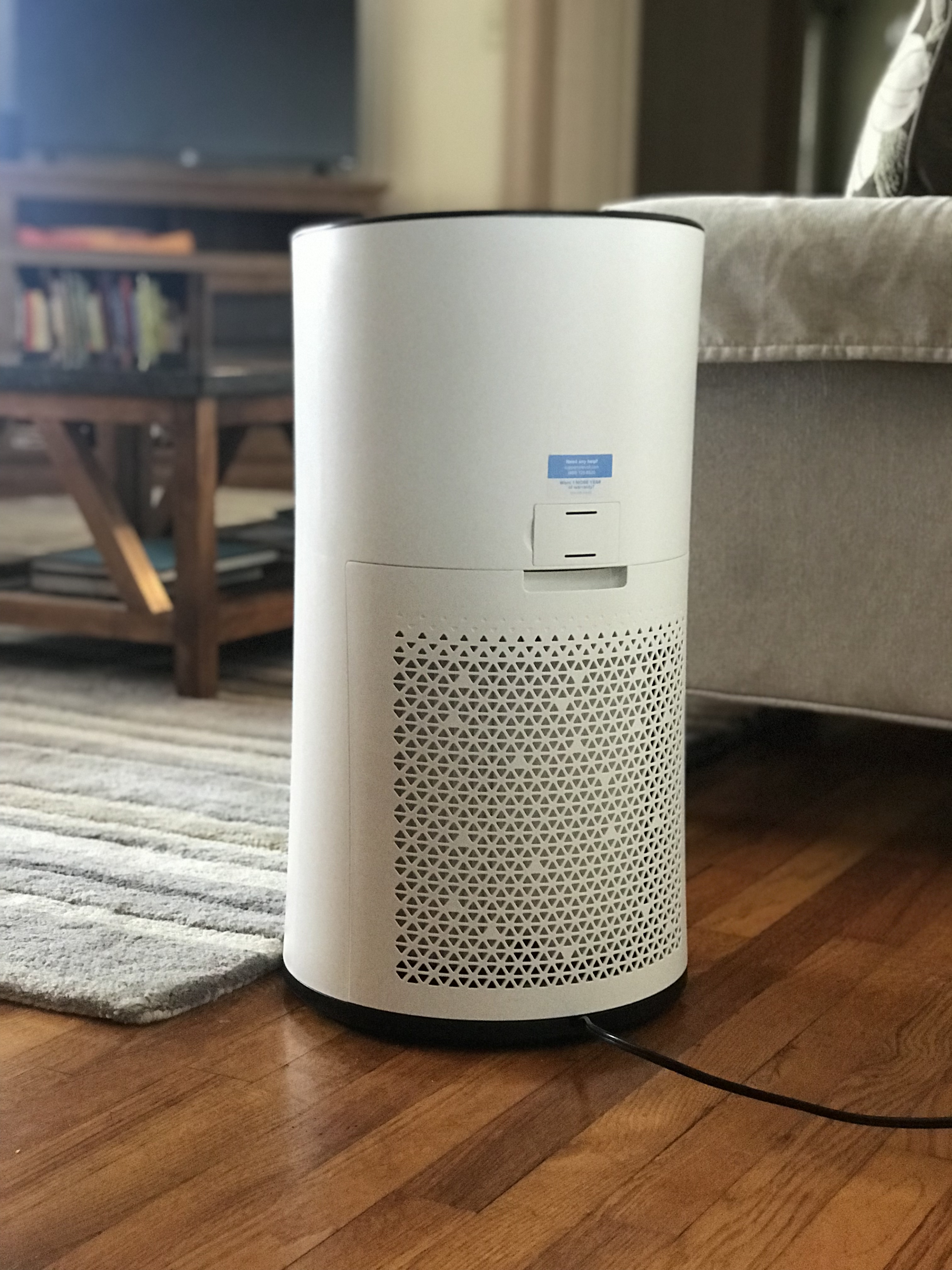 An air purifier in a living room next to a couch.

”Air Purifier (Levoit LV-H133) (49318568107)” by Home Air Quality Guides is licensed under CC BY-SA 2.0.