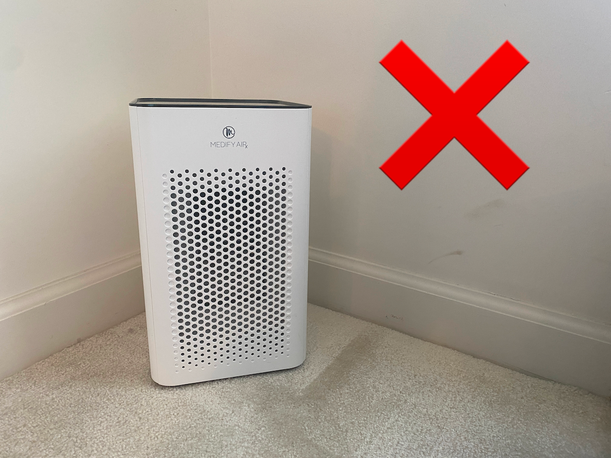 A Medify MA-25 air purifier tucked in a corner.